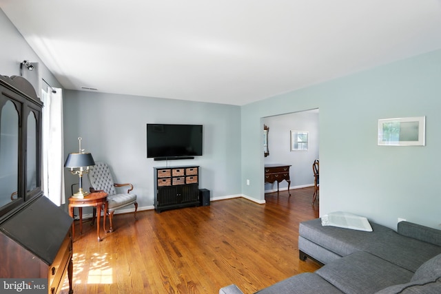 6082 Drum Point Rd, Deale, MD 20751 - living area with wood finished floors and baseboards