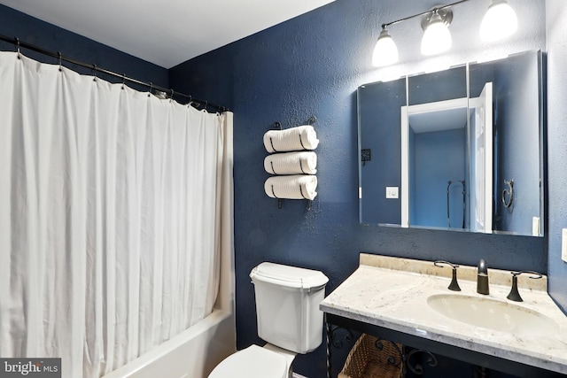 6082 Drum Point Rd, Deale, MD 20751 - bathroom featuring vanity, shower / bath combo with shower curtain, and a textured wall