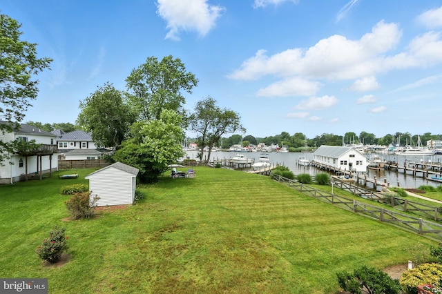 6082 Drum Point Rd, Deale, MD 20751 - view of yard with a shed, a water view, and a dock