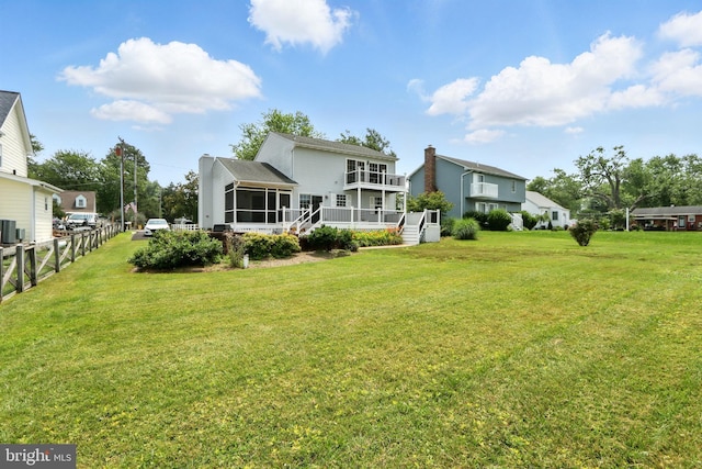 6082 Drum Point Rd, Deale, MD 20751 - back of house featuring a sunroom and a chimney