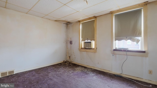 6254 Marsden St, Philadelphia, PA 19135 - empty room with a paneled ceiling, cooling unit, and baseboards