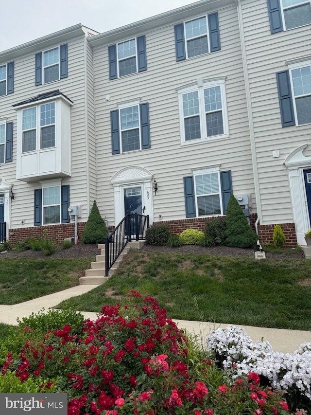 623 Waitkus Aly, Phoenixville, PA 19460 - view of front of house with brick siding and central air condition unit