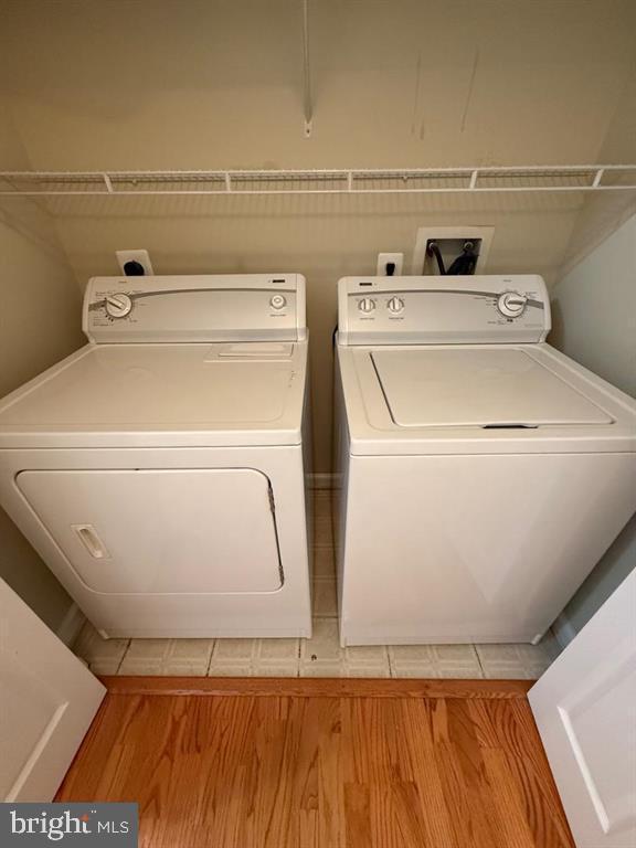 12000 Market St Unit 324, Reston, VA 20190 - laundry area with separate washer and dryer