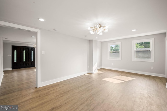 8255 Mertztown Rd, Alburtis, PA 18011 - unfurnished room featuring a chandelier, wood finished floors, recessed lighting, and baseboards