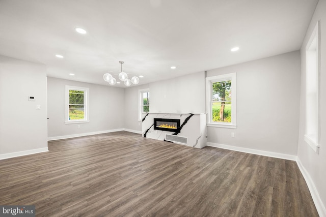 8255 Mertztown Rd, Alburtis, PA 18011 - unfurnished living room with recessed lighting, dark wood-style floors, a premium fireplace, baseboards, and a chandelier