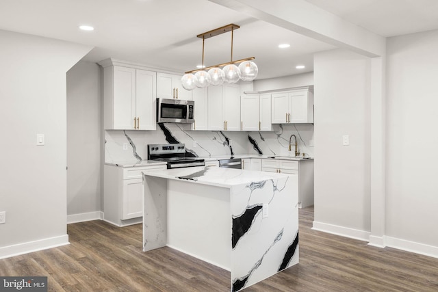 8255 Mertztown Rd, Alburtis, PA 18011 - kitchen featuring stainless steel appliances, a sink, recessed lighting, white cabinetry, and light stone countertops