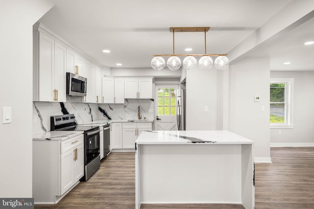 8255 Mertztown Rd, Alburtis, PA 18011 - kitchen with stainless steel appliances, recessed lighting, a center island, white cabinetry, and backsplash