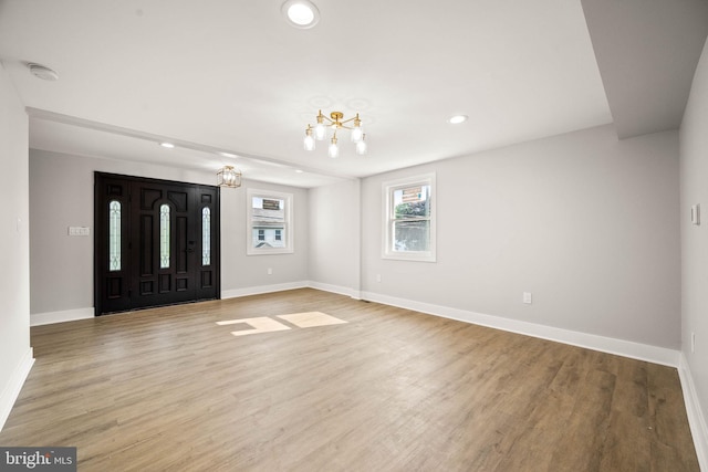 8255 Mertztown Rd, Alburtis, PA 18011 - foyer entrance featuring recessed lighting, a chandelier, baseboards, and light wood-style flooring