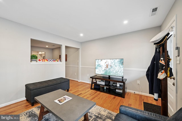 104 S St, Annapolis, MD 21401 - living room with wood finished floors, baseboards, and recessed lighting