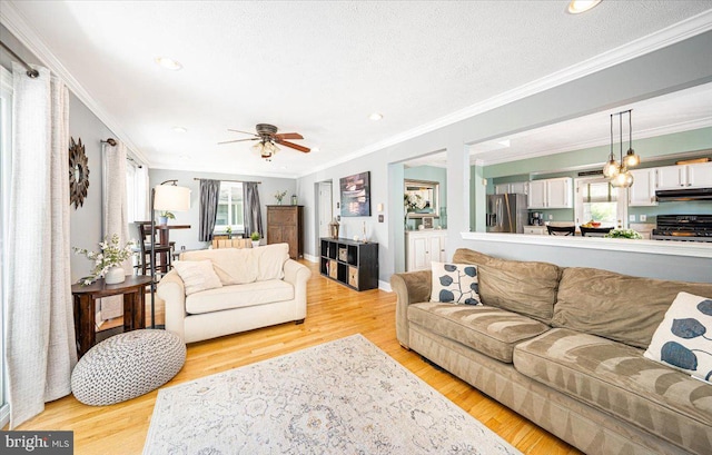 1323 Washington Dr, Annapolis, MD 21403 - living room with crown molding, ceiling fan, light wood-style flooring, and recessed lighting