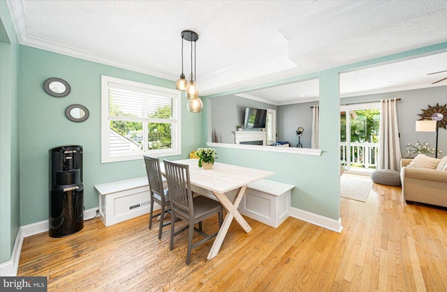 1323 Washington Dr, Annapolis, MD 21403 - dining room featuring light wood-style floors, ornamental molding, baseboards, and a textured ceiling