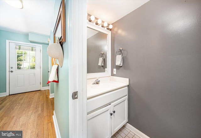 1323 Washington Dr, Annapolis, MD 21403 - bathroom with vanity, wood finished floors, and baseboards