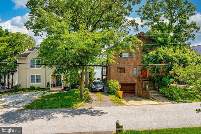 1323 Washington Dr, Annapolis, MD 21403 - view of front of property with driveway, an attached garage, stairs, and brick siding