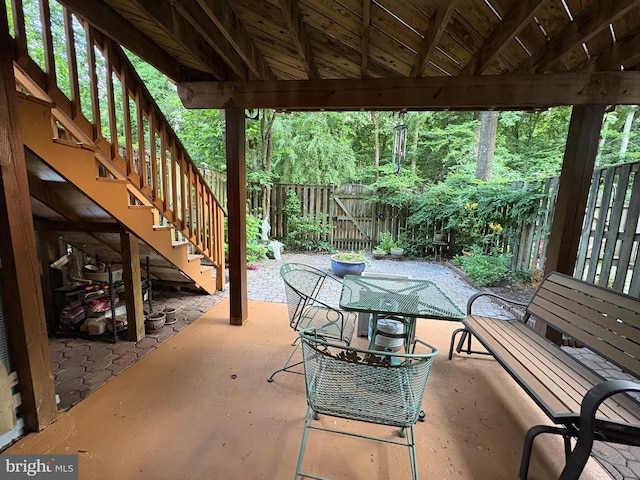 5930 Langton Dr, Franconia, VA 22310 - fenced backyard with a patio, stairs, and outdoor dining space