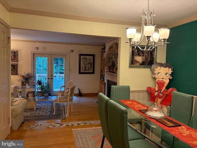 5930 Langton Dr, Franconia, VA 22310 - dining space with a chandelier, wood finished floors, crown molding, and a fireplace