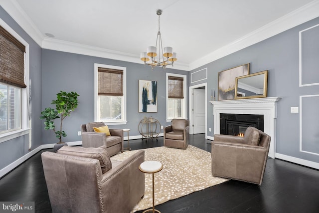 1200 Prince Edward St, Fredericksburg, VA 22401 - living area featuring a chandelier, dark wood-type flooring, crown molding, a glass covered fireplace, and baseboards