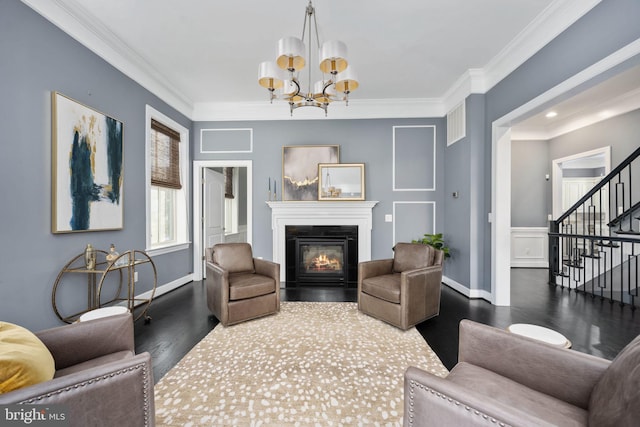 1200 Prince Edward St, Fredericksburg, VA 22401 - living room with wood finished floors, stairs, ornamental molding, a glass covered fireplace, and a chandelier