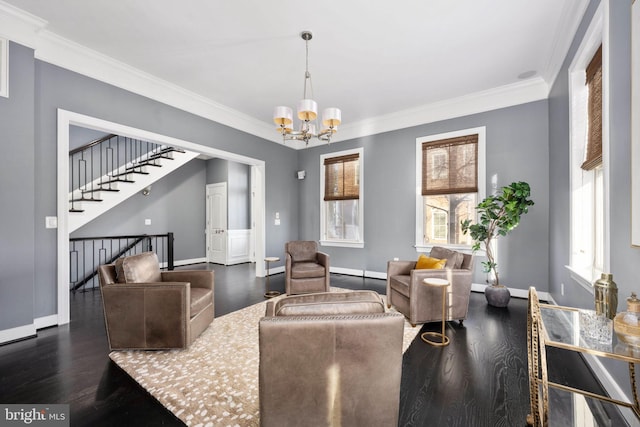 1200 Prince Edward St, Fredericksburg, VA 22401 - living room with a chandelier, wood finished floors, crown molding, baseboards, and stairs