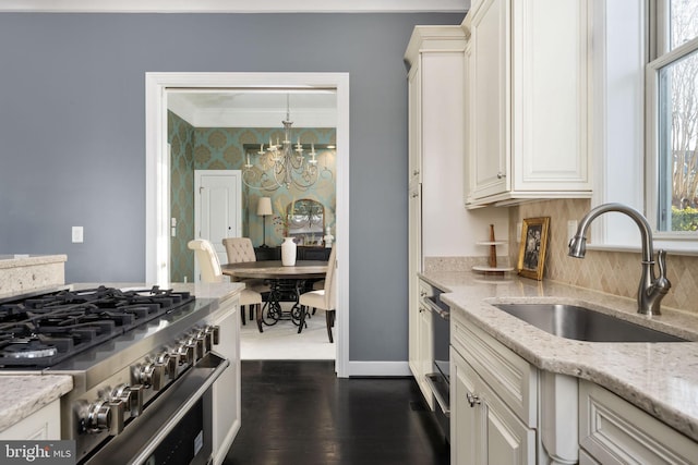 1200 Prince Edward St, Fredericksburg, VA 22401 - kitchen with high end stainless steel range oven, a sink, a chandelier, healthy amount of natural light, and ornamental molding