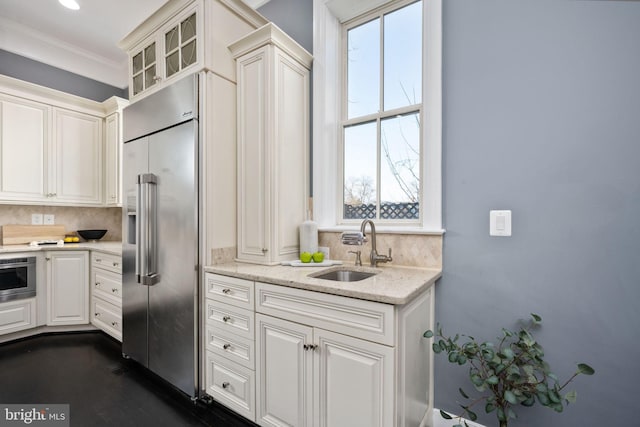 1200 Prince Edward St, Fredericksburg, VA 22401 - kitchen with built in fridge, a sink, decorative backsplash, glass insert cabinets, and crown molding