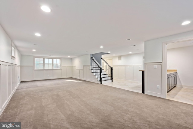1200 Prince Edward St, Fredericksburg, VA 22401 - basement featuring a decorative wall, light colored carpet, stairway, recessed lighting, and a wainscoted wall