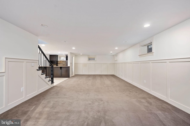 1200 Prince Edward St, Fredericksburg, VA 22401 - below grade area with a decorative wall, carpet floors, stairs, recessed lighting, and a wainscoted wall