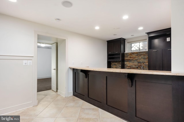 1200 Prince Edward St, Fredericksburg, VA 22401 - kitchen featuring a kitchen breakfast bar, light tile patterned floors, light countertops, recessed lighting, and baseboards