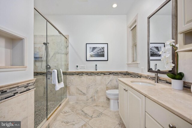 1200 Prince Edward St, Fredericksburg, VA 22401 - full bath with a stall shower, vanity, toilet, tile walls, and wainscoting