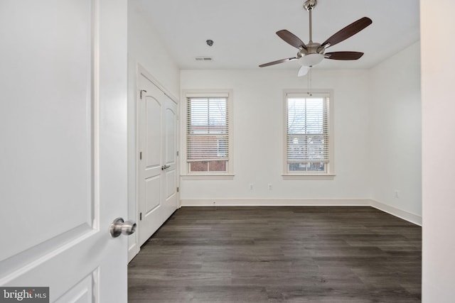 1200 Prince Edward St, Fredericksburg, VA 22401 - unfurnished bedroom featuring dark wood-type flooring, baseboards, and a ceiling fan