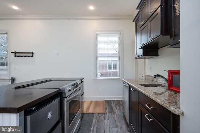 1200 Prince Edward St, Fredericksburg, VA 22401 - kitchen with appliances with stainless steel finishes, a sink, crown molding, dark brown cabinets, and dark wood finished floors