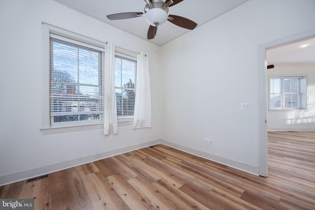1200 Prince Edward St, Fredericksburg, VA 22401 - unfurnished room featuring light wood-style floors, plenty of natural light, and baseboards
