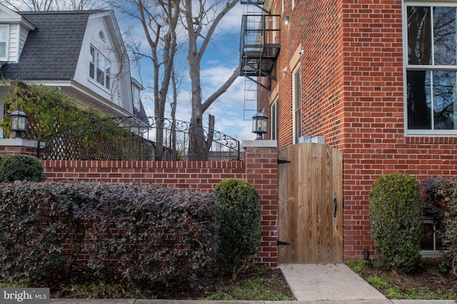 1200 Prince Edward St, Fredericksburg, VA 22401 - view of property exterior with brick siding and a gate