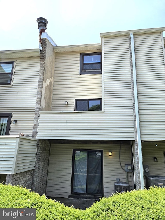 1605 Valley Dr Unit 1605, West Chester, PA 19382 - rear view of property with central air condition unit