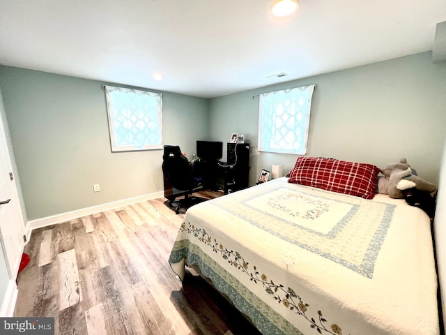 10213 Duvawn Pl, Silver Spring, MD 20902 - bedroom with wood finished floors, a desk, baseboards, and recessed lighting