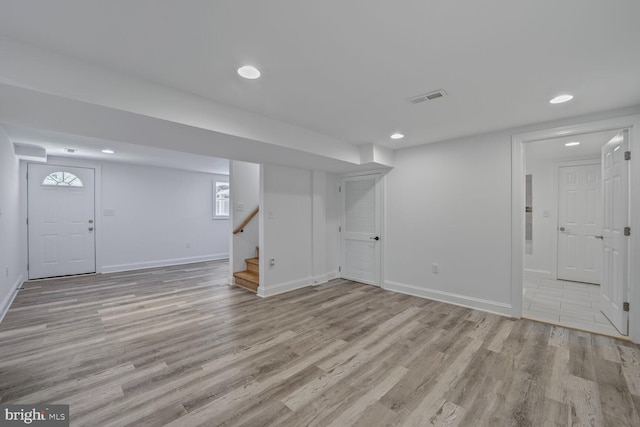 10213 Duvawn Pl, Silver Spring, MD 20902 - basement with wood finished floors, recessed lighting, and stairway