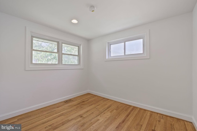 10213 Duvawn Pl, Silver Spring, MD 20902 - unfurnished room featuring a smoke detector, light wood-type flooring, and recessed lighting