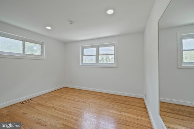 10213 Duvawn Pl, Silver Spring, MD 20902 - empty room featuring light wood-style floors, recessed lighting, and a smoke detector