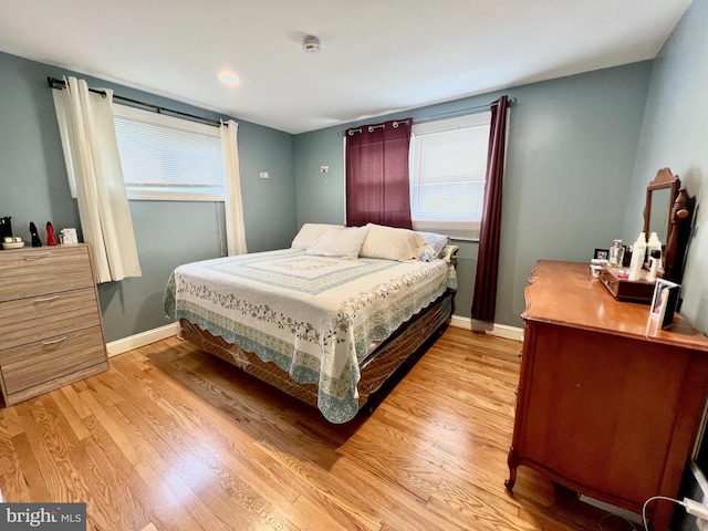 10213 Duvawn Pl, Silver Spring, MD 20902 - bedroom with light wood finished floors and baseboards