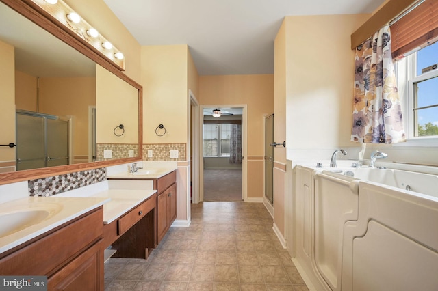 44 Homberg Cir, Dover, DE 19904 - bathroom with double vanity, healthy amount of natural light, a shower stall, and a garden tub