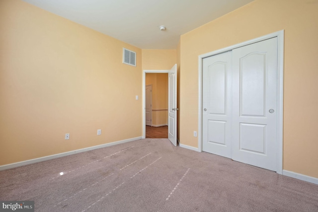 44 Homberg Cir, Dover, DE 19904 - unfurnished bedroom with carpet floors, baseboards, and a closet
