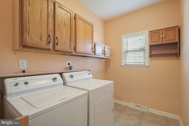 44 Homberg Cir, Dover, DE 19904 - washroom featuring washing machine and clothes dryer, baseboards, and cabinet space