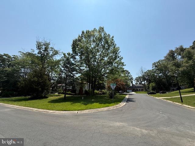 1247 Silver Run Dr, Pasadena, MD 21122 - view of asphalt road with curbs and traffic signs