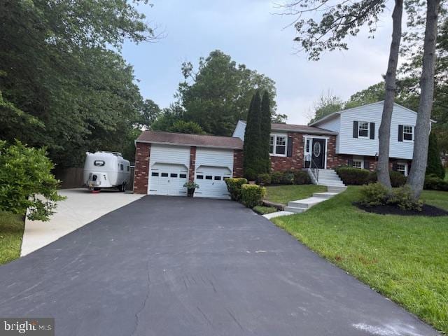 1247 Silver Run Dr, Pasadena, MD 21122 - tri-level home with a front yard, a garage, and brick siding