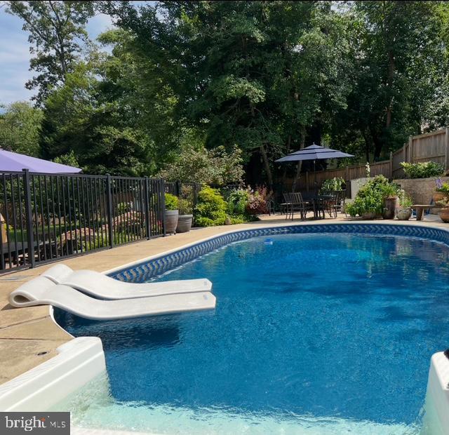 1247 Silver Run Dr, Pasadena, MD 21122 - view of swimming pool featuring a fenced backyard and a patio area