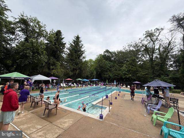 1247 Silver Run Dr, Pasadena, MD 21122 - community pool featuring a patio