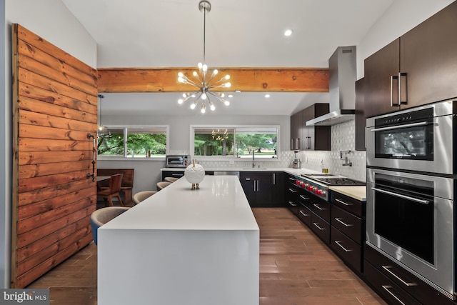 1004 Mercer Rd, Princeton, NJ 08540 - kitchen featuring appliances with stainless steel finishes, wall chimney exhaust hood, a chandelier, plenty of natural light, and beamed ceiling