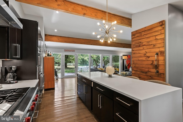 1004 Mercer Rd, Princeton, NJ 08540 - kitchen featuring exhaust hood, dark cabinets, beam ceiling, wood finished floors, and light countertops