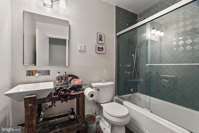 1004 Mercer Rd, Princeton, NJ 08540 - bathroom featuring toilet, bath / shower combo with glass door, and a sink