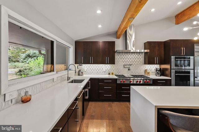 1004 Mercer Rd, Princeton, NJ 08540 - kitchen with a sink, appliances with stainless steel finishes, wall chimney exhaust hood, wood finished floors, and tasteful backsplash