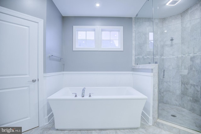 41031 Brook Grove Dr, Aldie, VA 20105 - bathroom featuring a freestanding bath, a stall shower, and wainscoting